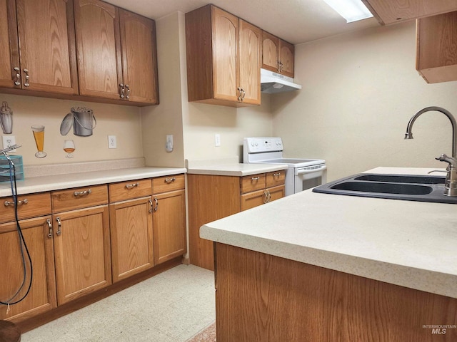 kitchen featuring white electric range and sink