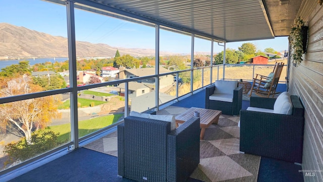 sunroom with a mountain view