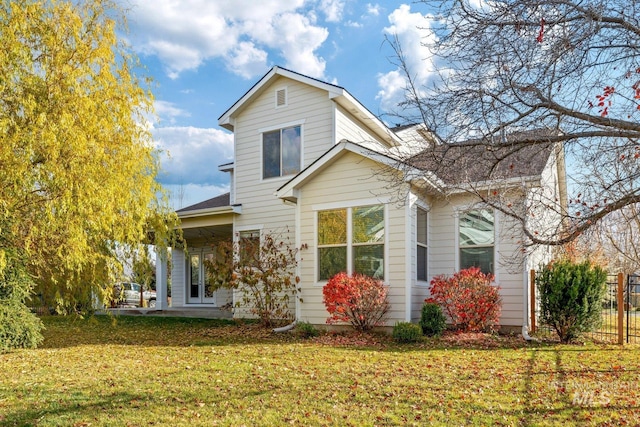 back of house with a yard