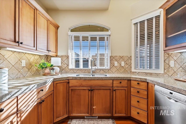 kitchen featuring a sink, a healthy amount of sunlight, visible vents, and stainless steel dishwasher