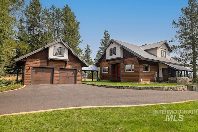 log home with a garage and a front lawn