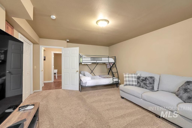 bedroom featuring light colored carpet