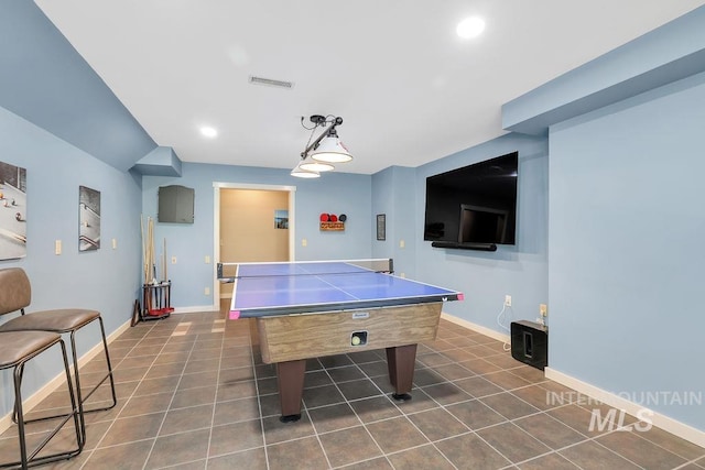 recreation room featuring dark tile patterned flooring