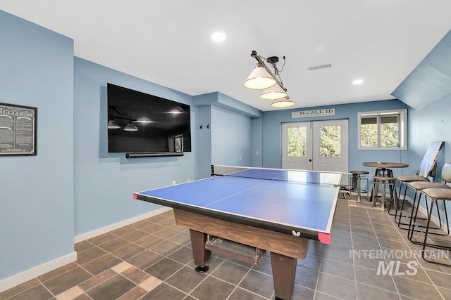 playroom featuring vaulted ceiling and french doors