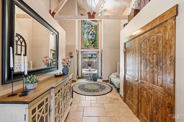 84 Jughandle Dr, Mccall, ID 83638 - foyer entrance featuring high vaulted ceiling, stone tile flooring, beamed ceiling, and wooden ceiling