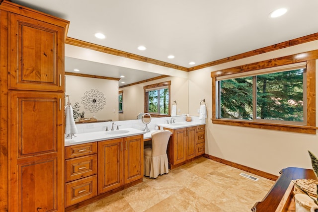 84 Jughandle Dr, Mccall, ID 83638 - bathroom with crown molding, baseboards, two vanities, and recessed lighting