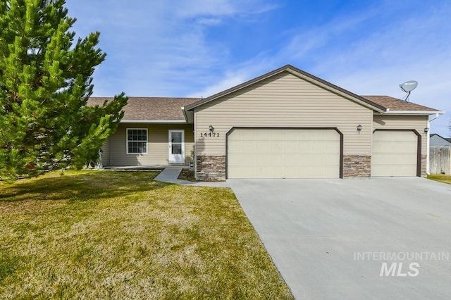 ranch-style house with a garage, stone siding, concrete driveway, and a front yard