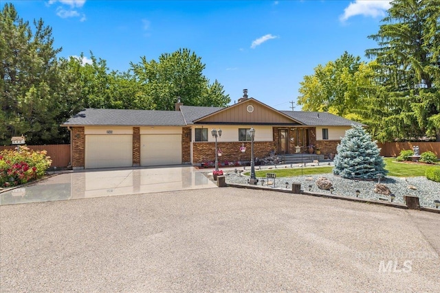 2503 Lyle Ct, Nampa, ID 83651 - ranch-style house featuring an attached garage, brick siding, and driveway