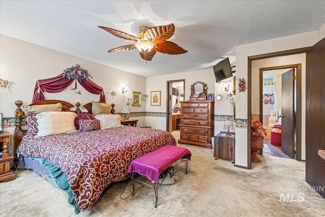 2503 Lyle Ct, Nampa, ID 83651 - bedroom featuring light colored carpet, ensuite bathroom, ceiling fan, and a textured ceiling