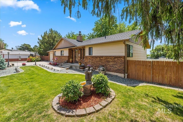 2503 Lyle Ct, Nampa, ID 83651 - view of front facade with brick siding and a chimney