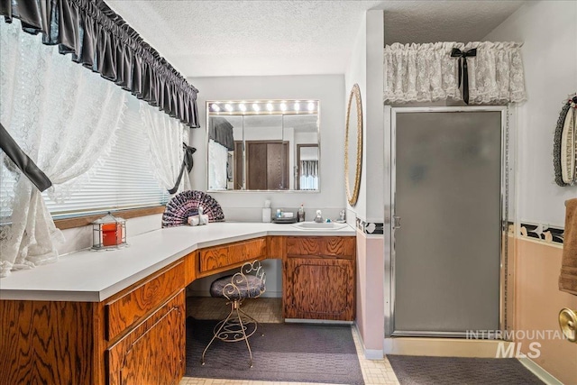 2503 Lyle Ct, Nampa, ID 83651 - full bath with a stall shower, vanity, a textured ceiling, and healthy amount of natural light