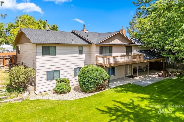 2503 Lyle Ct, Nampa, ID 83651 - back of property featuring a patio, a chimney, a deck, and roof with shingles