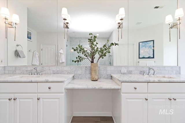 5446 E Branchwood Ct, Boise, ID 83716 - bathroom with two vanities, a shower with shower door, and wood finished floors