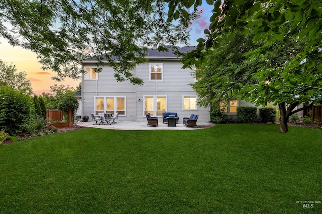 5446 E Branchwood Ct, Boise, ID 83716 - back of property at dusk with outdoor lounge area and a patio