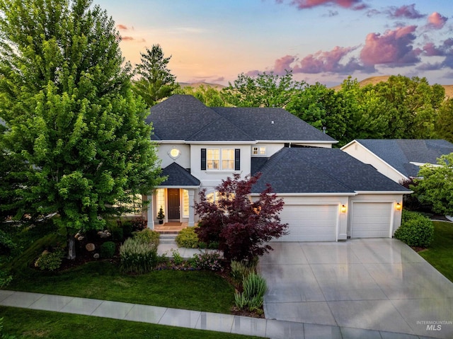 5446 E Branchwood Ct, Boise, ID 83716 - view of front facade featuring an attached garage, a shingled roof, concrete driveway, and a yard