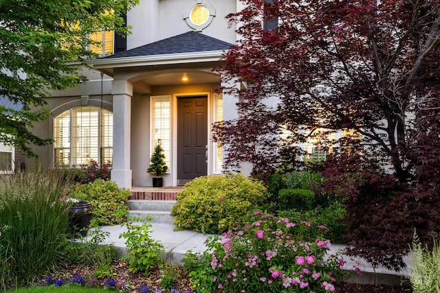 5446 E Branchwood Ct, Boise, ID 83716 - doorway to property featuring stucco siding, a shingled roof, and a porch