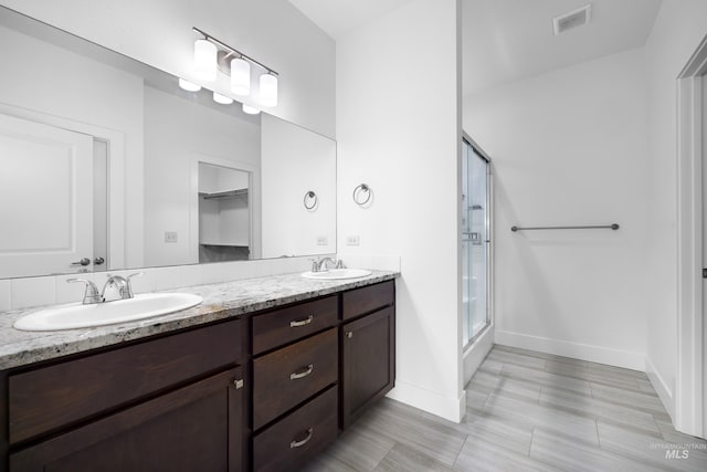 2928 W Los Flores Dr, Meridian, ID 83646 - full bath with baseboards, a shower stall, and double vanity