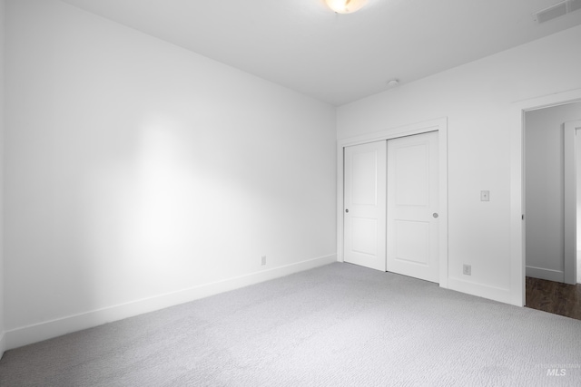 2928 W Los Flores Dr, Meridian, ID 83646 - unfurnished bedroom featuring carpet floors, a closet, and baseboards