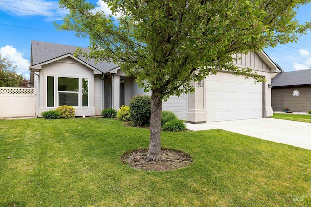 2928 W Los Flores Dr, Meridian, ID 83646 - view of front of home featuring concrete driveway, board and batten siding, and a garage