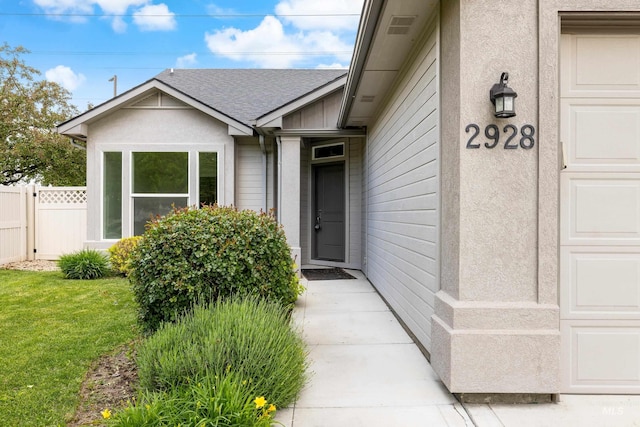 2928 W Los Flores Dr, Meridian, ID 83646 - entrance to property with fence and roof with shingles