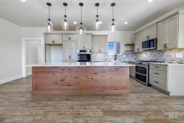 kitchen featuring a center island, open shelves, stainless steel appliances, decorative backsplash, and light wood-style floors