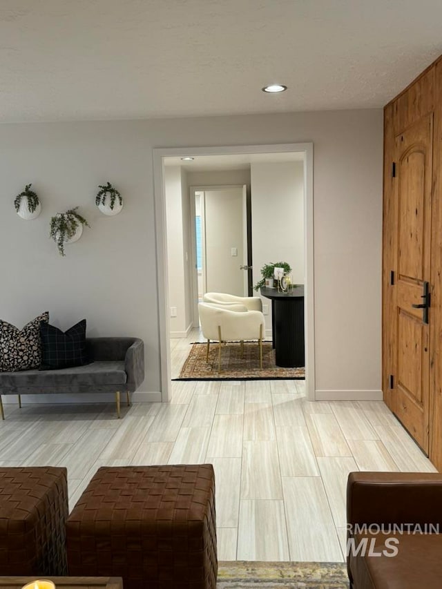 hallway with hardwood / wood-style floors