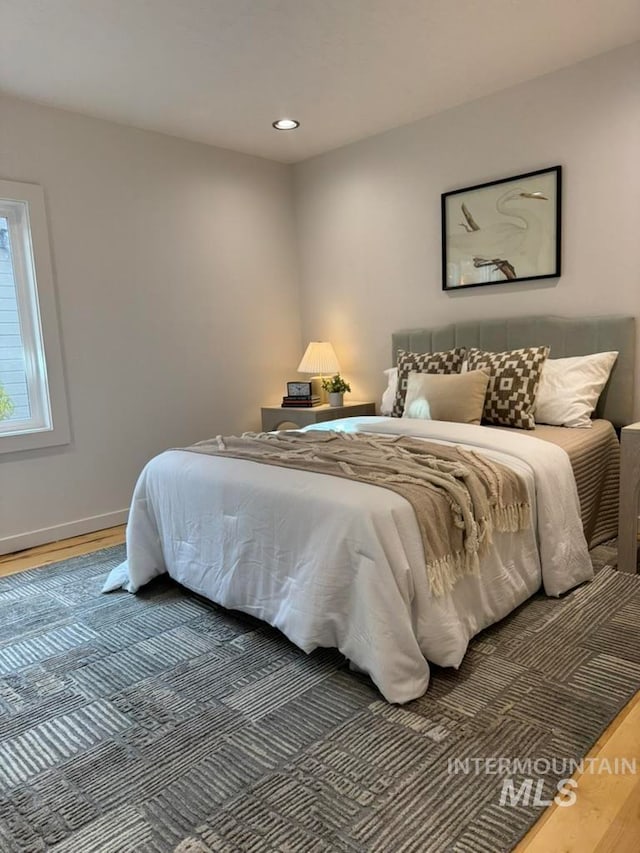 bedroom with wood-type flooring