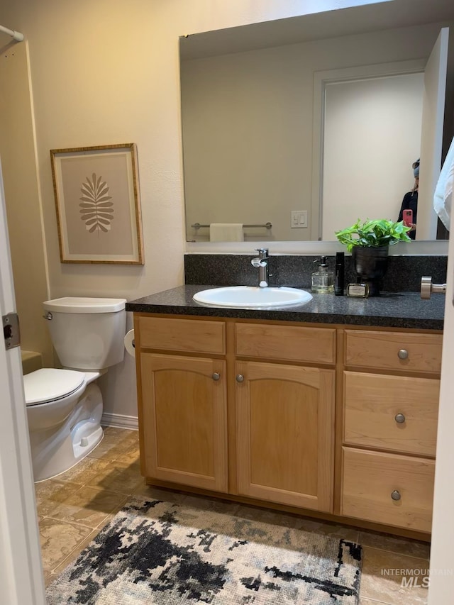 bathroom with vanity and toilet