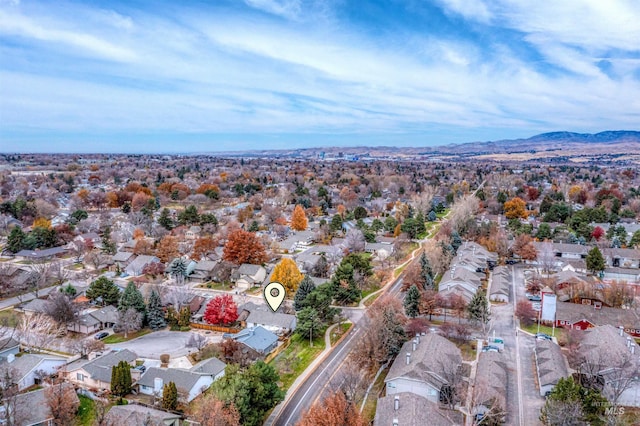 birds eye view of property featuring a mountain view