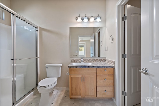 full bathroom with toilet, a stall shower, tile patterned floors, and vanity