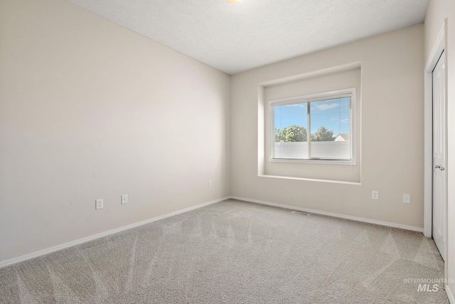 unfurnished bedroom with carpet and baseboards