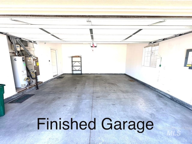garage featuring gas water heater and water heater