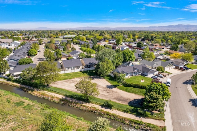 aerial view of residential area with mountains