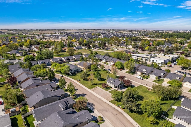 aerial view of property and surrounding area with nearby suburban area