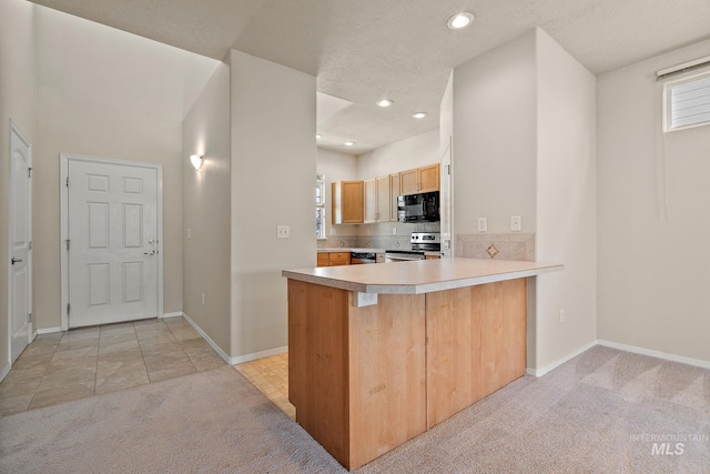 kitchen with black microwave, stainless steel range with electric stovetop, light colored carpet, baseboards, and recessed lighting