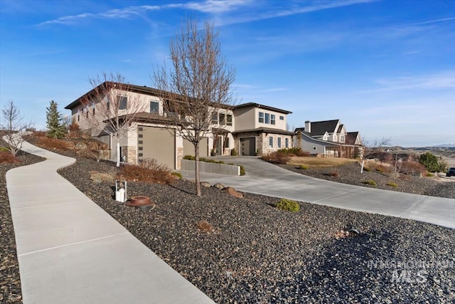 view of side of property with stucco siding and stone siding