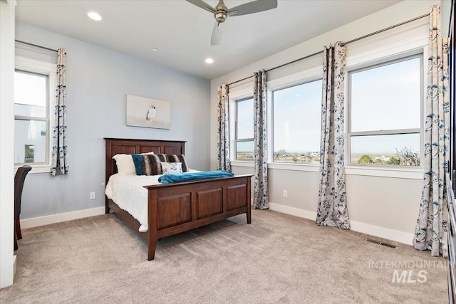 carpeted bedroom featuring visible vents, recessed lighting, and baseboards