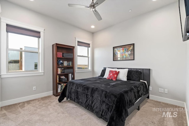 carpeted bedroom featuring recessed lighting, baseboards, and a ceiling fan