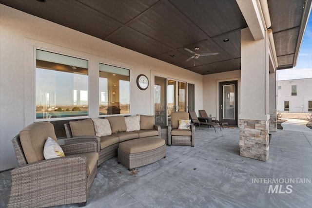 view of patio / terrace with an outdoor living space and ceiling fan