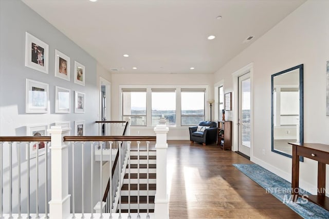 interior space featuring recessed lighting, visible vents, baseboards, and wood finished floors