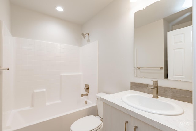 bathroom featuring recessed lighting, vanity, toilet, and shower / tub combination