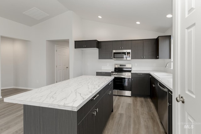 1078 Quartzite Ave, Middleton, ID 83644 - kitchen with a center island, stainless steel appliances, light wood finished floors, and visible vents