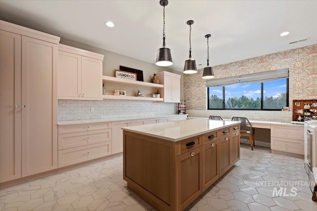 kitchen featuring a center island, light tile patterned floors, hanging light fixtures, and tasteful backsplash