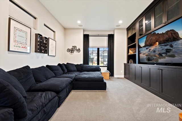 living room featuring light carpet