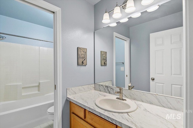 full bathroom with vanity, tub / shower combination, and toilet