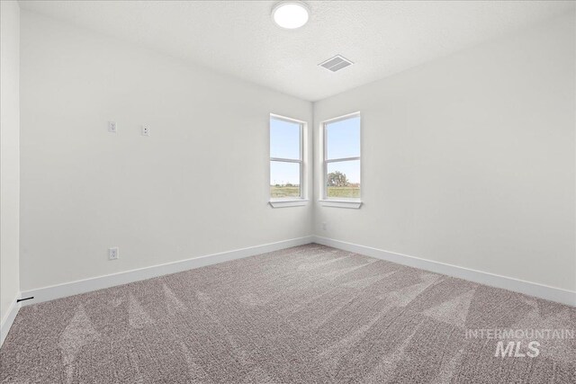 empty room with carpet flooring