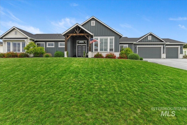 20150 Silver Spur Dr, Wilder, ID 83676 - view of front of property with board and batten siding, an attached garage, concrete driveway, and a front yard