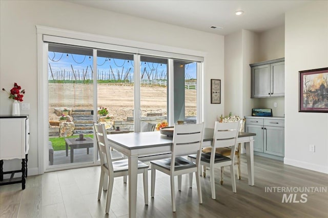 20150 Silver Spur Dr, Wilder, ID 83676 - dining space featuring light wood finished floors, baseboards, and recessed lighting