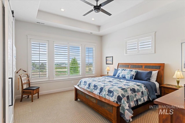 20150 Silver Spur Dr, Wilder, ID 83676 - bedroom featuring light colored carpet, baseboards, recessed lighting, a tray ceiling, and ceiling fan