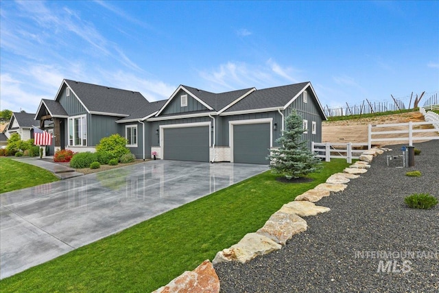 20150 Silver Spur Dr, Wilder, ID 83676 - view of front of property featuring a garage, board and batten siding, and driveway